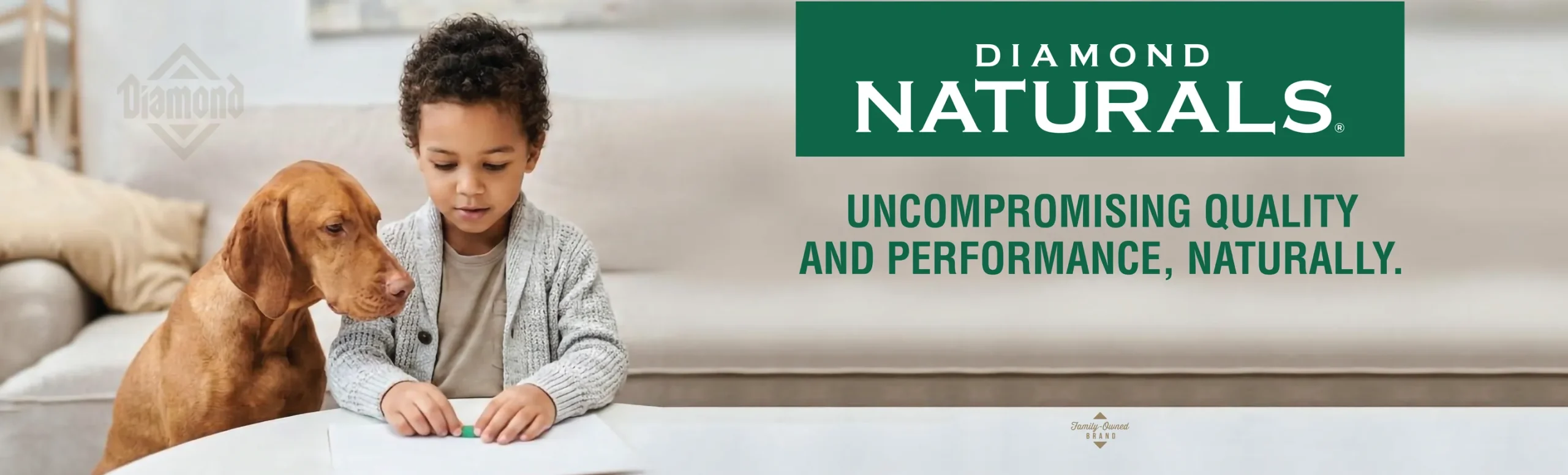 Diamond Naturals logo and the words “Uncompromising quality and performance, naturally” — a boy at a table with a vizsla beside him